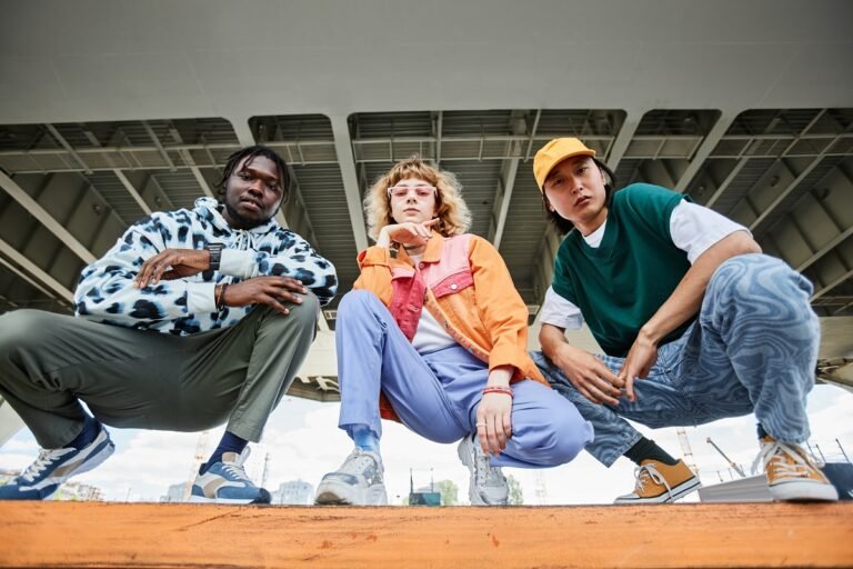 Group,Of,Three,Young,People,Wearing,Street,Style,Clothes,Outdoors